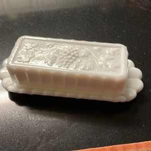 Milk glass butter dish. A few chips but not noticeable..